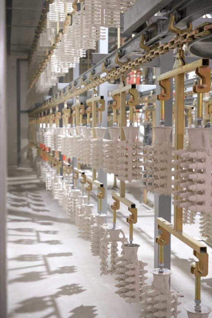 Automated shell room with overhead conveyor drying system, showcasing high efficiency at Aohai investment casting foundry.